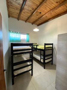 Ένα ή περισσότερα κρεβάτια σε δωμάτιο στο Complejo Entre Nubes