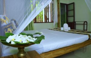Postel nebo postele na pokoji v ubytování Golden Lodge Tangalle