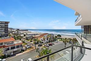 a view of the beach from the balcony of a building at 2BR Luxury Central Palm Beach Apartment (Best Location!) in Gold Coast