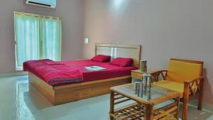 AYM Yoga Resort Arambol GOA客房内的一张或多张床位