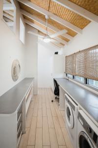 a laundry room with a washer and dryer at Solwota Sands in Port Vila