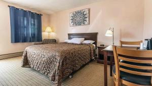 מיטה או מיטות בחדר ב-Best Travel Inn Philipsburg