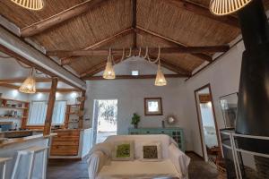 a living room with a white couch and some lights at Bolonia Beach Campus in Tarifa