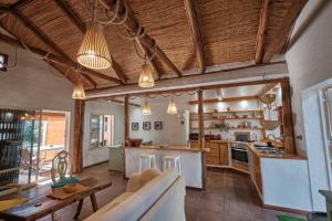a large kitchen with a couch and a table at Bolonia Beach Campus in Tarifa