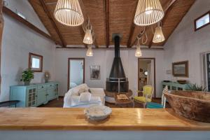 a living room with a table and a fireplace at Bolonia Beach Campus in Tarifa