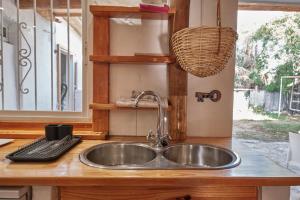 a kitchen counter with a sink and a keyboard at Bolonia Beach Campus in Tarifa