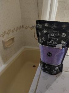 a bag sitting on top of a bath tub at Ananda in Ushuaia +32 photos