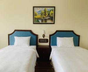 Postel nebo postele na pokoji v ubytování CALYSSA HOTELS & VILLAGE