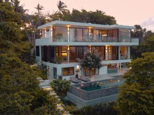 an aerial view of a house with a swimming pool at Casa Alma by Elite Havens in Nai Harn Beach