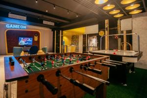 a foosball table in a room with a game on at Yello Hotel Harbour Bay in Nagoya