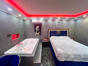 a bathroom with a bed and a tub and a bed sidx sidx sidx at LEVENT PALACE OTEL in Istanbul