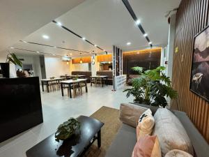 a living room with a couch and a table at Ariano's Inn in Butuan