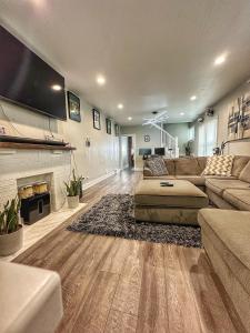 a large living room with a couch and a fireplace at Modern Luxe 3BR/1BA with Bar in Columbus
