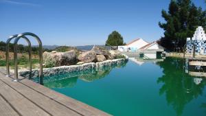 a view of a body of water with a dock at Bela Vista Silo Housing in Alfândega da Fé