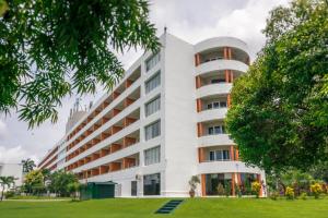 an external view of a white building at Inya Lake Hotel in Yangon