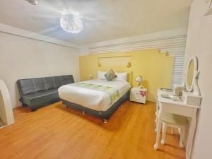 Rúm í herbergi á Xiong Zhi Mi B&B