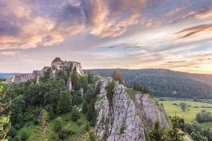 a castle on top of a rocky mountain at Studio « Le petit montagnard » in Malbuisson