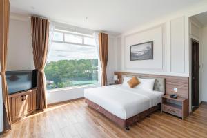 Postel nebo postele na pokoji v ubytování PINE VIEW Hotel Dalat