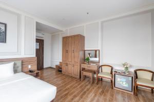 Postel nebo postele na pokoji v ubytování PINE VIEW Hotel Dalat