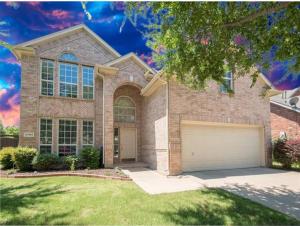 a large brick house with a garage at Feel Home at Frisco in Frisco