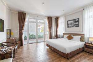 Postel nebo postele na pokoji v ubytování PINE VIEW Hotel Dalat