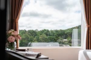 Balkón nebo terasa v ubytování PINE VIEW Hotel Dalat
