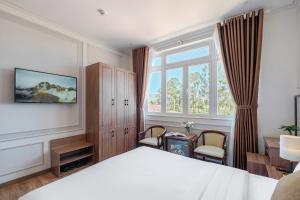 Postel nebo postele na pokoji v ubytování PINE VIEW Hotel Dalat