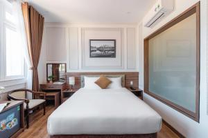 Postel nebo postele na pokoji v ubytování PINE VIEW Hotel Dalat
