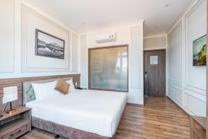 Postel nebo postele na pokoji v ubytování PINE VIEW Hotel Dalat