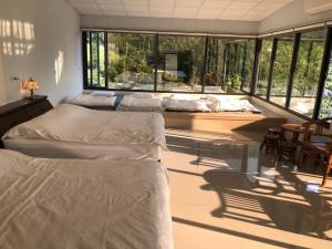 Una cama o camas en una habitación de Bao Chi B&B