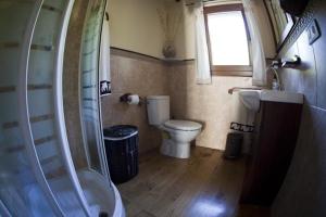 a small bathroom with a toilet and a shower at Ferienhaus für 6 Personen ca 140 qm in Porto do Son, Costa Verde Spanien Rías Baixas in Porto do Son