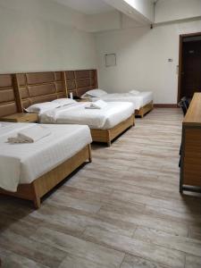 Krevet ili kreveti u jedinici u okviru objekta Meaco Royal Hotel - Valenzuela