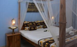 Postel nebo postele na pokoji v ubytování Golden Lodge Tangalle