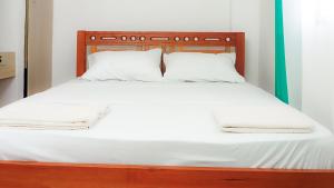 Łóżko lub łóżka w pokoju w obiekcie Seaside Heights 2BR 43' Smart TV