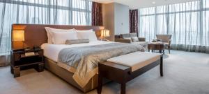 Postel nebo postele na pokoji v ubytování Nanyuan Universe Deluxe Hotel