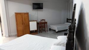 Tempat tidur dalam kamar di Hotel Turazzi