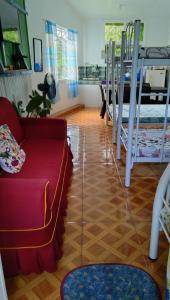 a living room with a couch and bunk beds at Havilah House Baguio City in Baguio