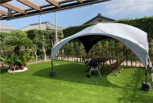 a tent on a lawn with a table and chairs at Tateyama City - Camp - Vacation STAY 42217v 