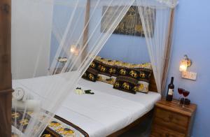 Postel nebo postele na pokoji v ubytování Golden Lodge Tangalle