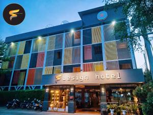 a jason hotel with motorcycles parked in front of it at The S Design Hotel in Buriram