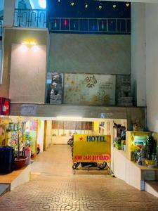 a building with a hotel sign in the middle of a hallway at Trung Bảo Hotel in Ho Chi Minh City
