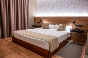 Łóżko lub łóżka w pokoju w obiekcie Hotel Luve