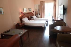 Postel nebo postele na pokoji v ubytování Dreams Suites