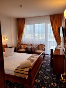 Postel nebo postele na pokoji v ubytování Hotel Belvedere