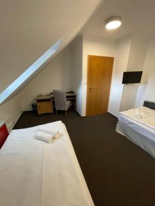 Postel nebo postele na pokoji v ubytování Hotel PAYER