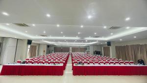 a large room with red tables and chairs at PSA Nghi Sơn Condotel in Thanh Hóa +41 photos