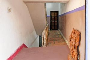 Postel nebo postele na pokoji v ubytování Super OYO 16535 Chilika Residency