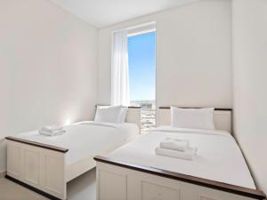 Llit o llits en una habitació de Spacious 3BDR Plus Guest Room in Creek Harbour