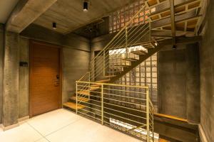 a metal spiral staircase in a building with a door at BEL VISTO in Vālpārai