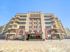 a large apartment building in a city at Studio Unit In Lincoln Park B In Arjan in Dubai